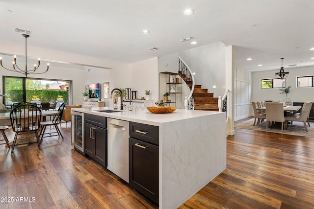 9904 E S Bend Dr, Scottsdale, AZ 85255 - kitchen with a chandelier, dishwasher, a sink, dark wood finished floors, and recessed lighting