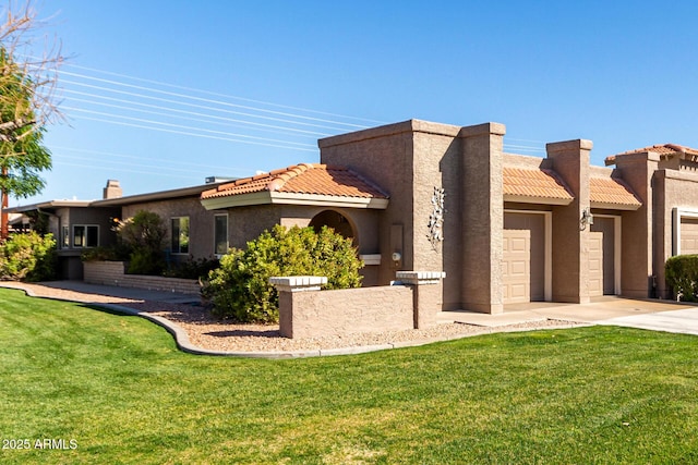 mediterranean / spanish house with a front lawn