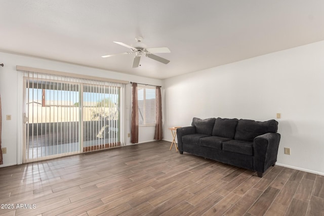 living room with hardwood / wood-style flooring and ceiling fan