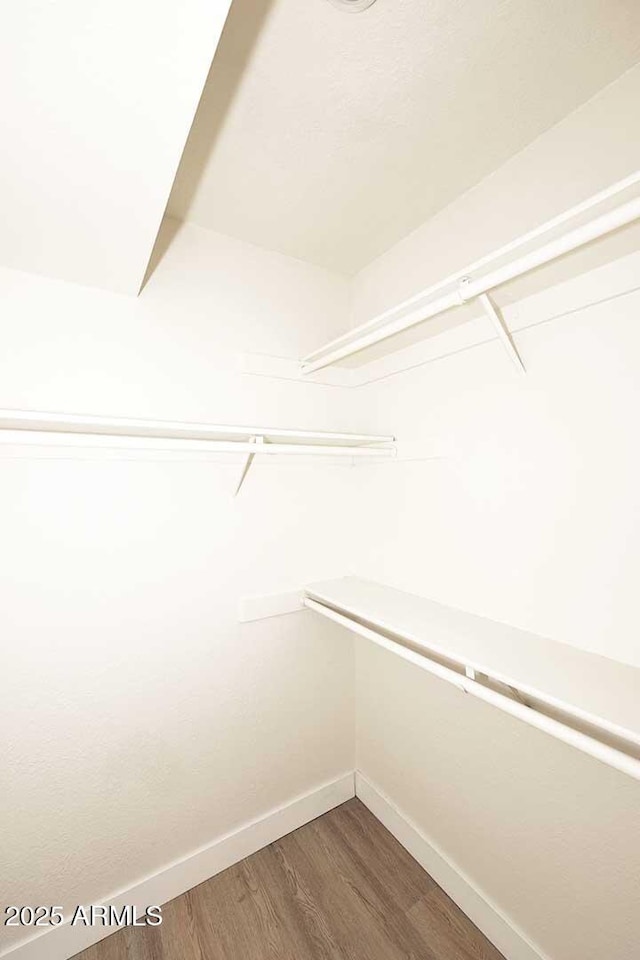 15801 N 29th St N Unit 20, Phoenix, AZ 85032 - walk in closet featuring wood finished floors