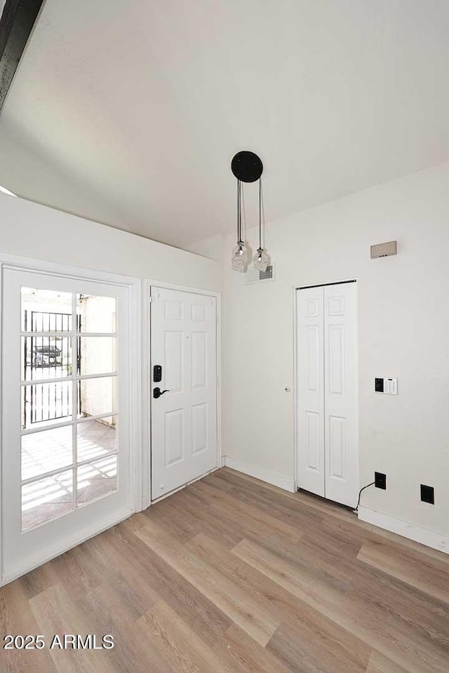 15801 N 29th St N Unit 20, Phoenix, AZ 85032 - unfurnished dining area featuring light wood finished floors and baseboards