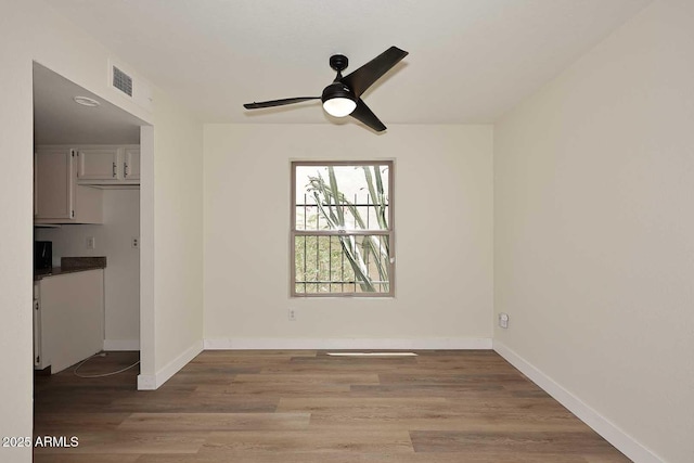15801 N 29th St N Unit 20, Phoenix, AZ 85032 - unfurnished room with a ceiling fan, wood finished floors, and baseboards