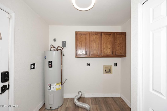 15801 N 29th St N Unit 20, Phoenix, AZ 85032 - laundry room featuring water heater, cabinet space, electric dryer hookup, wood finished floors, and baseboards