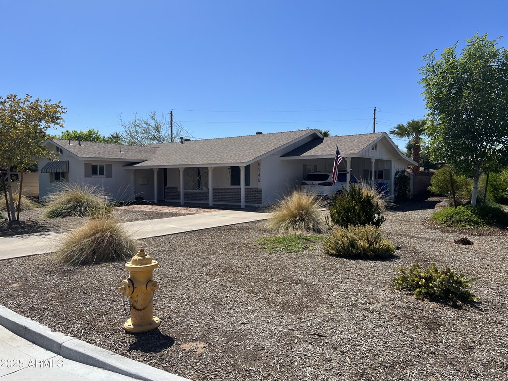 6546 N 16th Ave, Phoenix, AZ 85015 - single story home featuring stucco siding, driveway, and a shingled roof