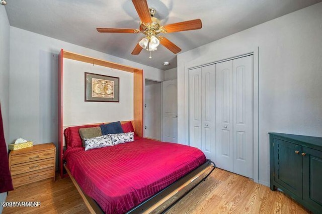 bedroom featuring a closet, a ceiling fan, and light wood-style floors