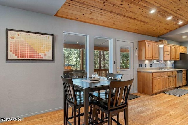 dining area with wooden ceiling, light wood-style floors, baseboards, and a wealth of natural light