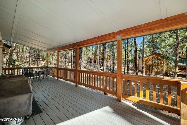 wooden deck with outdoor dining area