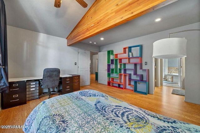 bedroom featuring recessed lighting, wood finished floors, and vaulted ceiling