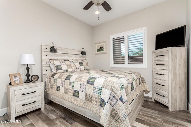 bedroom featuring dark hardwood / wood-style flooring and ceiling fan