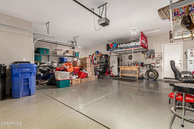 garage featuring a workshop area and a garage door opener