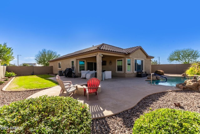 back of house with a fenced in pool, a patio area, and central AC