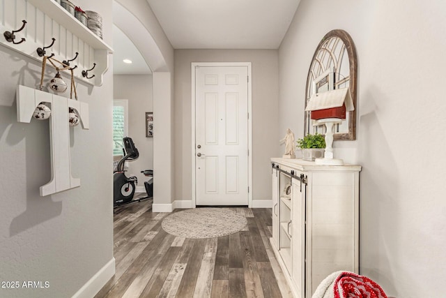 entryway with wood-type flooring