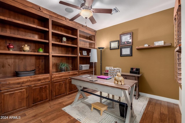 office area featuring light hardwood / wood-style flooring and ceiling fan