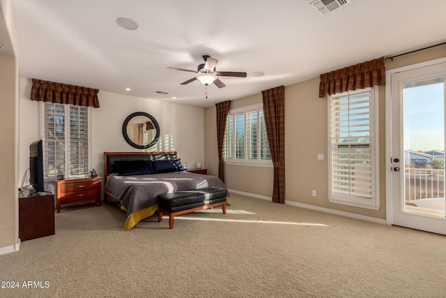 bedroom featuring carpet, access to outside, multiple windows, and ceiling fan