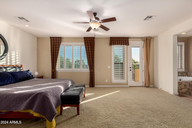 bedroom featuring ensuite bath, ceiling fan, access to outside, and multiple windows