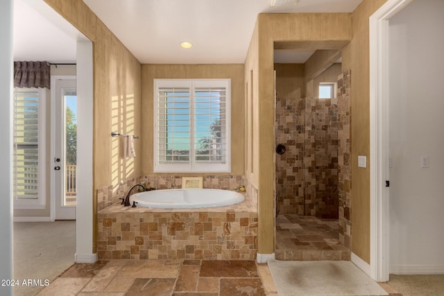 bathroom featuring plus walk in shower