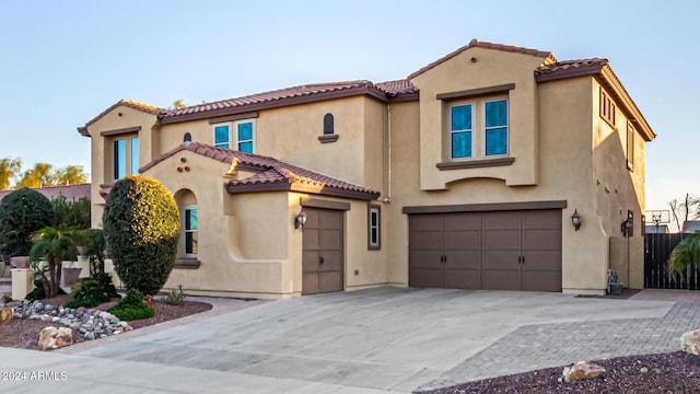 mediterranean / spanish-style house featuring a garage