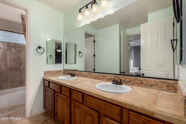 bathroom featuring tile patterned floors, ceiling fan, vanity, and bathtub / shower combination