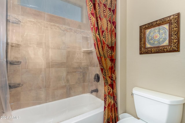 bathroom featuring toilet and shower / tub combo