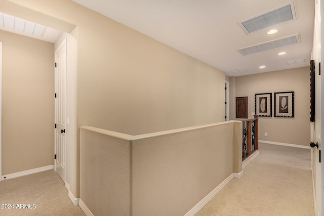 hallway with light colored carpet