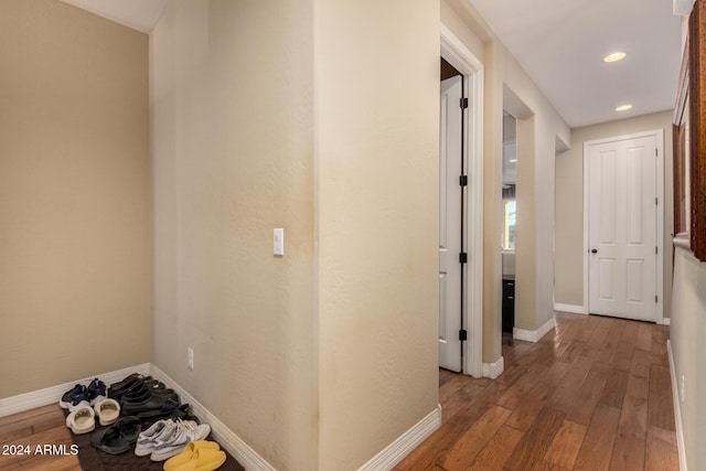 hallway with light hardwood / wood-style flooring