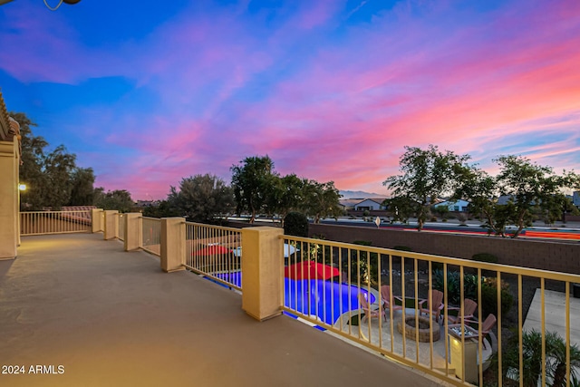 view of balcony at dusk