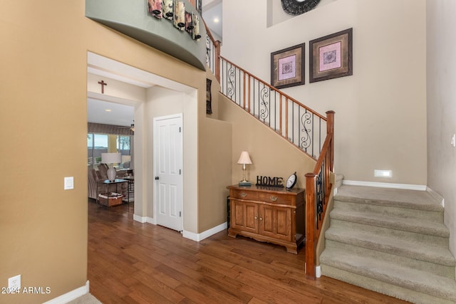 stairs with hardwood / wood-style flooring