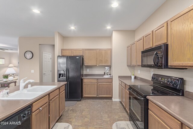 kitchen with sink and black appliances