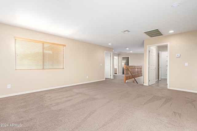 unfurnished living room with carpet