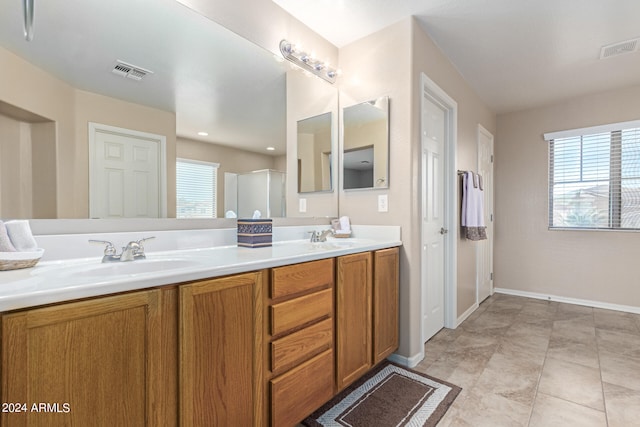 bathroom with vanity and tile patterned flooring