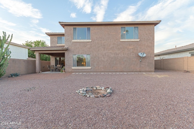 back of house featuring a patio area