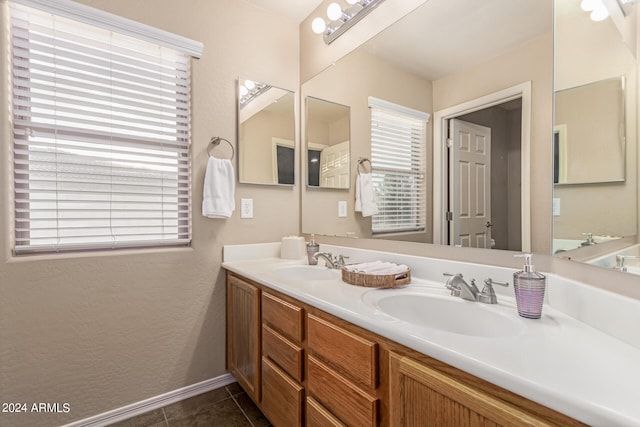 bathroom with tile patterned flooring and vanity