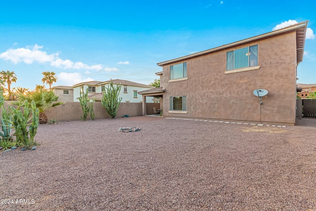 rear view of property featuring a patio area