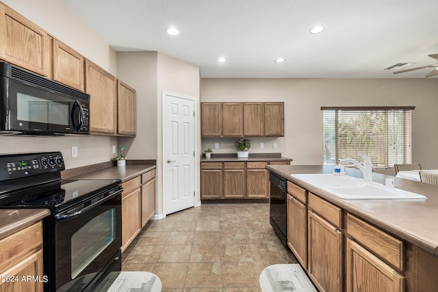 kitchen featuring ceiling fan, sink, and black appliances