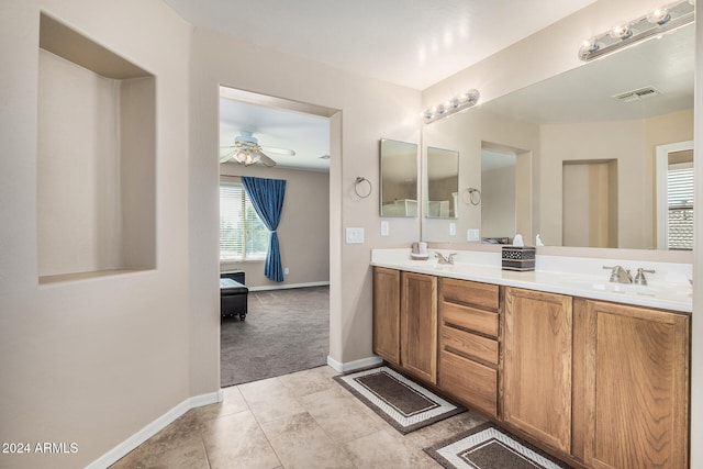 bathroom featuring ceiling fan, vanity, and tile patterned flooring