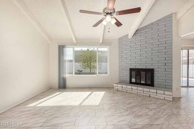 unfurnished living room featuring ceiling fan, vaulted ceiling with beams, a textured ceiling, and a fireplace