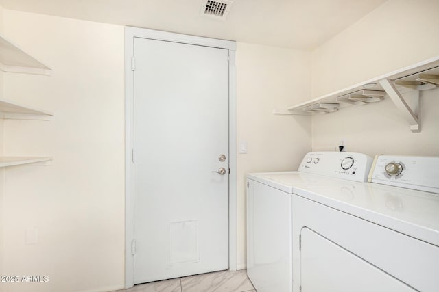 washroom with separate washer and dryer