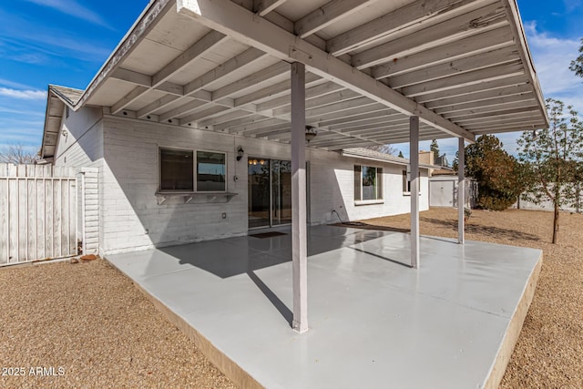 view of patio with a shed