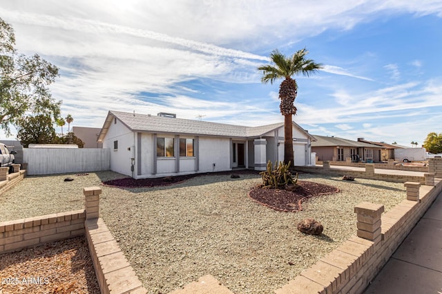 ranch-style house featuring a garage