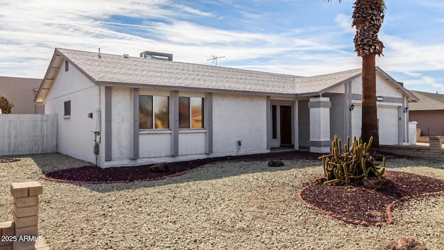 ranch-style home featuring a garage