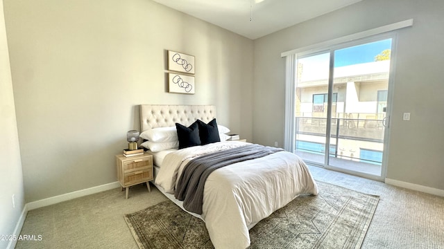 bedroom with light carpet, access to outside, and baseboards