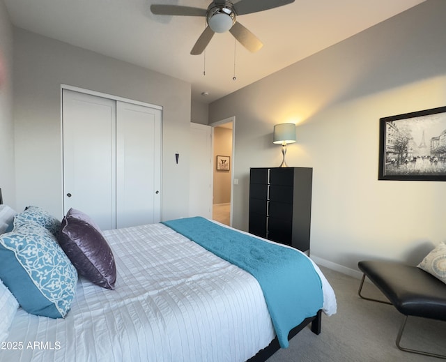 carpeted bedroom featuring baseboards, a ceiling fan, and a closet