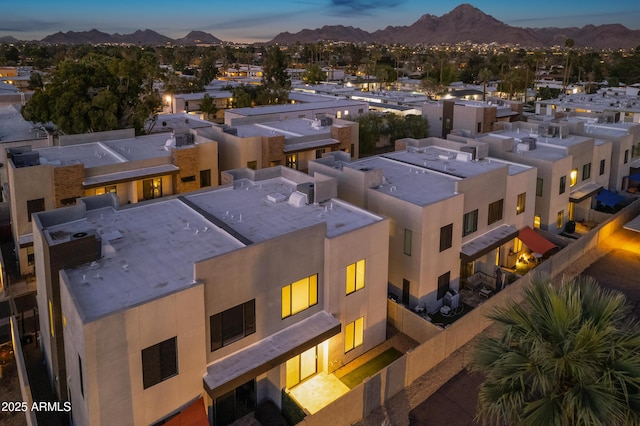 birds eye view of property with a mountain view