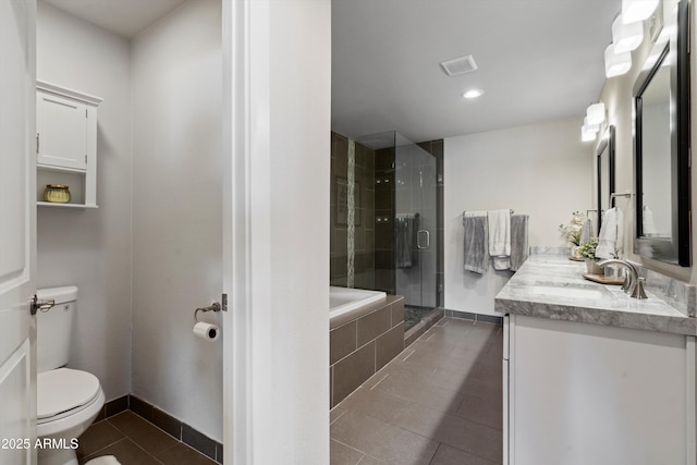 full bathroom featuring tile patterned floors, vanity, toilet, and independent shower and bath