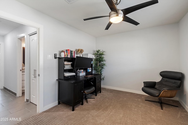 tiled office featuring ceiling fan