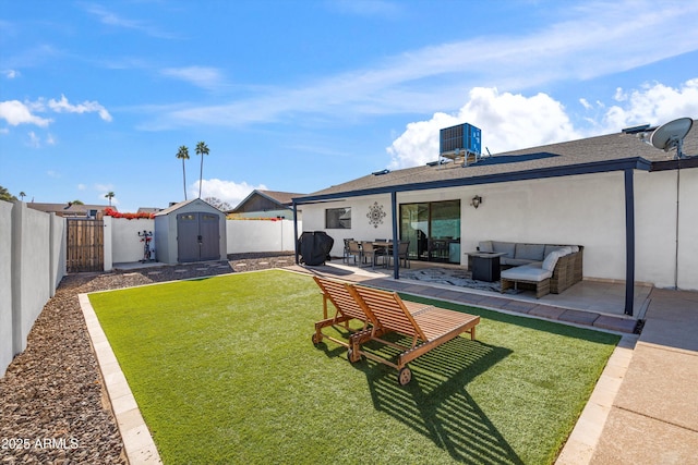 back of property featuring an outdoor living space, central AC, a yard, a patio, and a shed