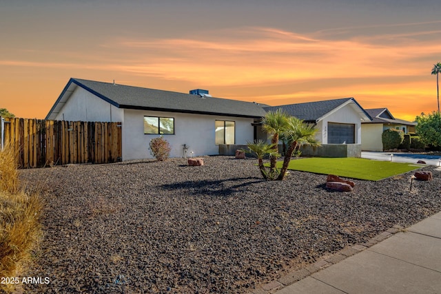 ranch-style house featuring a lawn