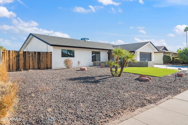 ranch-style house featuring a front lawn