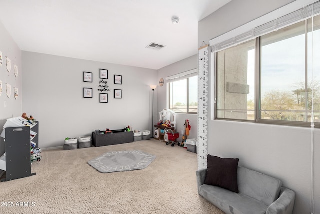 playroom with carpet flooring and visible vents