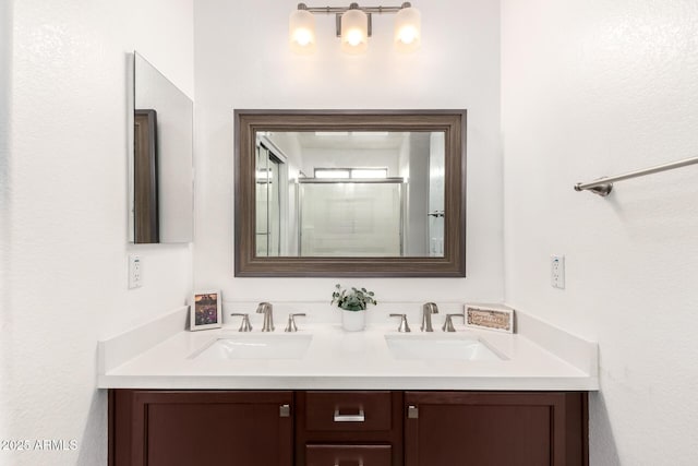 full bath with double vanity and a sink